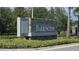 A stone community sign for Barrington surrounded by lush landscaping and mature trees on a sunny day at 13111 Pepper Stem St, Spring Hill, FL 34609