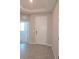 Inviting entryway with neutral paint, stylish tile floors and a modern front door at 13111 Pepper Stem St, Spring Hill, FL 34609