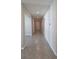 Hallway featuring neutral tones and tile flooring at 13111 Pepper Stem St, Spring Hill, FL 34609