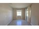Open living room featuring ceramic tile flooring at 13111 Pepper Stem St, Spring Hill, FL 34609