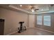Bright living room featuring a tray ceiling, recessed lighting, and neutral paint at 13111 Pepper Stem St, Spring Hill, FL 34609