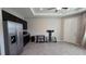 Open living room with stainless steel appliances and dark wood cabinets at 13111 Pepper Stem St, Spring Hill, FL 34609