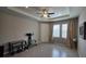 Bright living room featuring a tray ceiling, recessed lighting, and neutral paint at 13111 Pepper Stem St, Spring Hill, FL 34609
