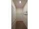 A simple walk-in closet with neutral walls, carpet, and a wire rack for easy storage and organization at 13111 Pepper Stem St, Spring Hill, FL 34609
