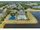 Aerial view of community amenities including a pool, playground, and lake at 13336 Graham Yarden Dr, Riverview, FL 33579