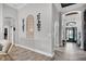 Elegant foyer featuring an arched entrance and stylish flooring at 13336 Graham Yarden Dr, Riverview, FL 33579