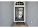 Welcoming entryway with a glass-paneled front door and tiled floor at 13336 Graham Yarden Dr, Riverview, FL 33579
