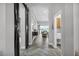 Inviting hallway with wood-look flooring and stylish decor at 13336 Graham Yarden Dr, Riverview, FL 33579