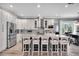 Open kitchen with center island, stainless steel appliances, and breakfast bar with seating at 13336 Graham Yarden Dr, Riverview, FL 33579