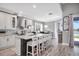 Spacious kitchen with center island, breakfast bar, stainless steel appliances, and modern finishes at 13336 Graham Yarden Dr, Riverview, FL 33579