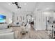 Spacious living room with wood floors, bright lighting, and an open layout at 13336 Graham Yarden Dr, Riverview, FL 33579