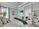 The light and bright primary suite features a peek into the ensuite bath with tub at 13336 Graham Yarden Dr, Riverview, FL 33579