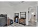 Office space view with shelving, gray flooring, and a peek into the hallway at 13336 Graham Yarden Dr, Riverview, FL 33579