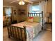 Comfortable bedroom with a decorative bed, large windows for natural light, and neutral color palette at 14530 Apache Ave, Largo, FL 33774
