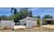 A single story home featuring a white privacy fence at 14530 Apache Ave, Largo, FL 33774