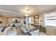 Open-concept dining area with modern furniture, seamlessly connected to the kitchen and living spaces at 15021 Oxford Grey Dr, Lakewood Ranch, FL 34211
