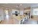Modern kitchen with spacious island, stainless steel appliances, and ample seating for casual dining at 15021 Oxford Grey Dr, Lakewood Ranch, FL 34211