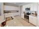 Spacious kitchen featuring stainless steel appliances, a granite countertop island, and white cabinetry at 15021 Oxford Grey Dr, Lakewood Ranch, FL 34211
