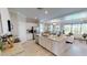 Open-concept kitchen featuring a large island, stainless steel appliances, and seamless connection to living area at 15021 Oxford Grey Dr, Lakewood Ranch, FL 34211