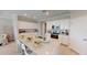 Bright kitchen with white cabinets, granite countertops, and stainless steel appliances at 15021 Oxford Grey Dr, Lakewood Ranch, FL 34211