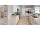 Modern kitchen with stainless steel appliances, granite countertops, and ample cabinet space at 15021 Oxford Grey Dr, Lakewood Ranch, FL 34211