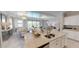 Spacious kitchen features granite countertops, stainless steel appliances, and an open layout with views of living areas at 15021 Oxford Grey Dr, Lakewood Ranch, FL 34211