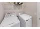 Clean laundry room featuring a modern washer and dryer for convenient home chores at 15021 Oxford Grey Dr, Lakewood Ranch, FL 34211