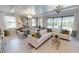 Open-concept living room offering seamless indoor-outdoor living with direct access to the pool area at 15021 Oxford Grey Dr, Lakewood Ranch, FL 34211