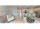 Spacious living room featuring a modern design, seamlessly connected to the open kitchen and dining area at 15021 Oxford Grey Dr, Lakewood Ranch, FL 34211