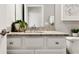 Stylish bathroom featuring a granite countertop, bright lighting, and modern fixtures at 15107 Oxford Grey Dr, Bradenton, FL 34211