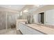 Spacious bathroom with double sinks, granite countertops, and walk-in shower at 15107 Oxford Grey Dr, Bradenton, FL 34211