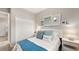 Charming bedroom with a comfortable bed, closet, and soothing decor at 15107 Oxford Grey Dr, Bradenton, FL 34211