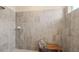 Modern shower featuring tiled walls, bench seating and neutral hues at 15107 Oxford Grey Dr, Bradenton, FL 34211