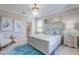 Inviting bedroom with calming blue accents, decorative artwork, and elegant furnishings at 15135 Oxford Grey Dr, Bradenton, FL 34211