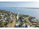 Aerial shot of a home on a street with water views at 1794 Santa Barbara Dr, Dunedin, FL 34698