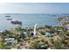 Wide aerial view showcasing home's proximity to waterfront, bridges and cityscape at 1794 Santa Barbara Dr, Dunedin, FL 34698