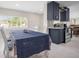 Dining area with natural light showcases shaker cabinets and stainless steel appliances at 1794 Santa Barbara Dr, Dunedin, FL 34698
