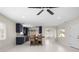 Bright kitchen with shaker cabinets, modern appliances, and a large island with seating at 1794 Santa Barbara Dr, Dunedin, FL 34698