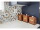 Close up of kitchen details featuring quartz countertop, patterned backsplash, and decorative wooden canisters at 1794 Santa Barbara Dr, Dunedin, FL 34698