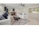 Open-concept living space with ample natural light, a kitchen view and comfortable seating at 1794 Santa Barbara Dr, Dunedin, FL 34698
