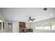 Bright living room featuring fireplace, large windows, and minimalist design at 1794 Santa Barbara Dr, Dunedin, FL 34698