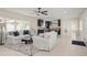 Bright living room with neutral tones, comfortable white sofas, and an open floor plan at 1794 Santa Barbara Dr, Dunedin, FL 34698
