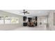 Expansive living space featuring a modern kitchen, dining area, and bright, airy ambiance at 1794 Santa Barbara Dr, Dunedin, FL 34698