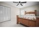 Bedroom featuring natural light, white closet doors and comfortable furnishings at 1794 Santa Barbara Dr, Dunedin, FL 34698