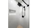 Modern shower with a rainfall showerhead and built in niche at 1794 Santa Barbara Dr, Dunedin, FL 34698
