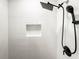 Modern shower featuring a rainfall showerhead, handheld sprayer, and niche at 1794 Santa Barbara Dr, Dunedin, FL 34698