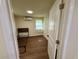 Simple bedroom with hardwood floors and ample light, awaiting personalization and decor at 18452 Fort Dade Ave, Brooksville, FL 34601