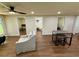 Inviting living space with wood-look flooring and views into bedrooms and bathrooms at 18452 Fort Dade Ave, Brooksville, FL 34601