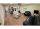 Spacious living area connecting seamlessly to a modern kitchen and comfortable seating at 18452 Fort Dade Ave, Brooksville, FL 34601