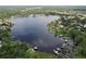 Breathtaking aerial view of a serene lake community, perfect for nature lovers and those seeking tranquility at 1902 Rebecca Rd, Lutz, FL 33548
